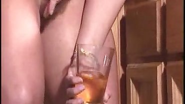 Sexy MILF drinks her own piss